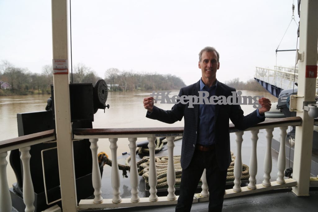 Tim Johnston with Keep Reading Sign